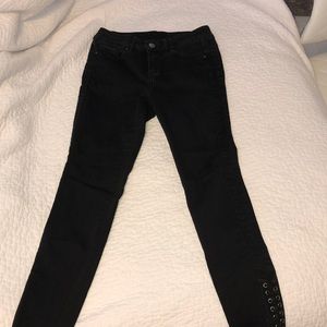 black jeans with tie detail at ankle